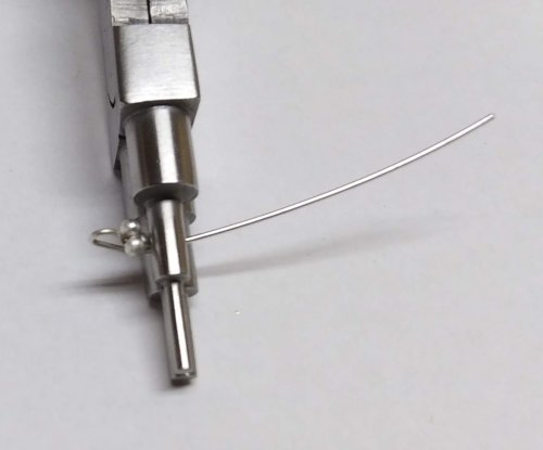 Judy Larson's Bali Style Earrings - , Contemporary Wire Jewelry, Stamping, Stamps, Butane Torch, Soldering, Solder, Drilling, Drill, Position the ball embellished wire loop end of a wire